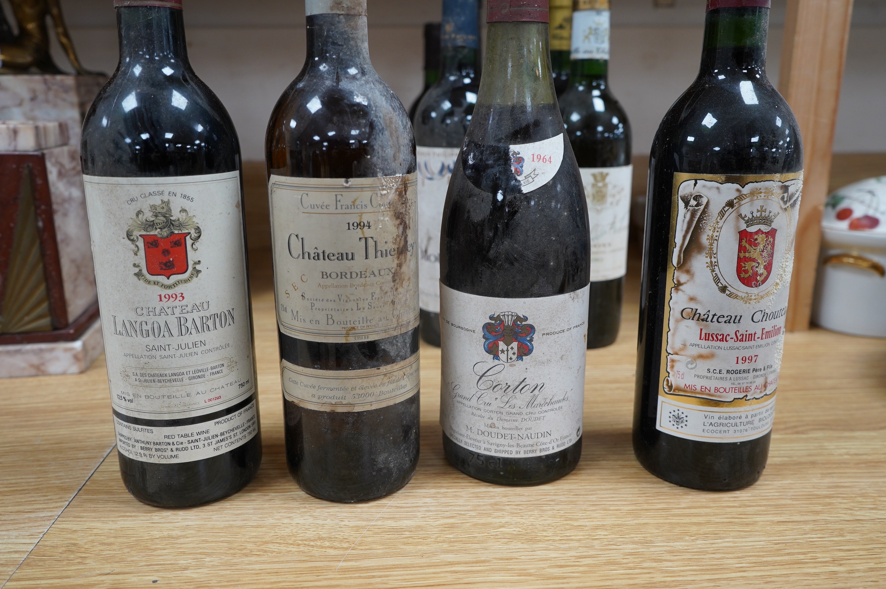Twelve bottles of mixed red and white wine; a bottle of Chateau d’Ardennes 1989, a bottle of Chateau Chouteau, 1997, Lussac - Saint - Emilion, and two bottles of Chateau Langoa Barton, Saint Julien 1993 (12). Condition -